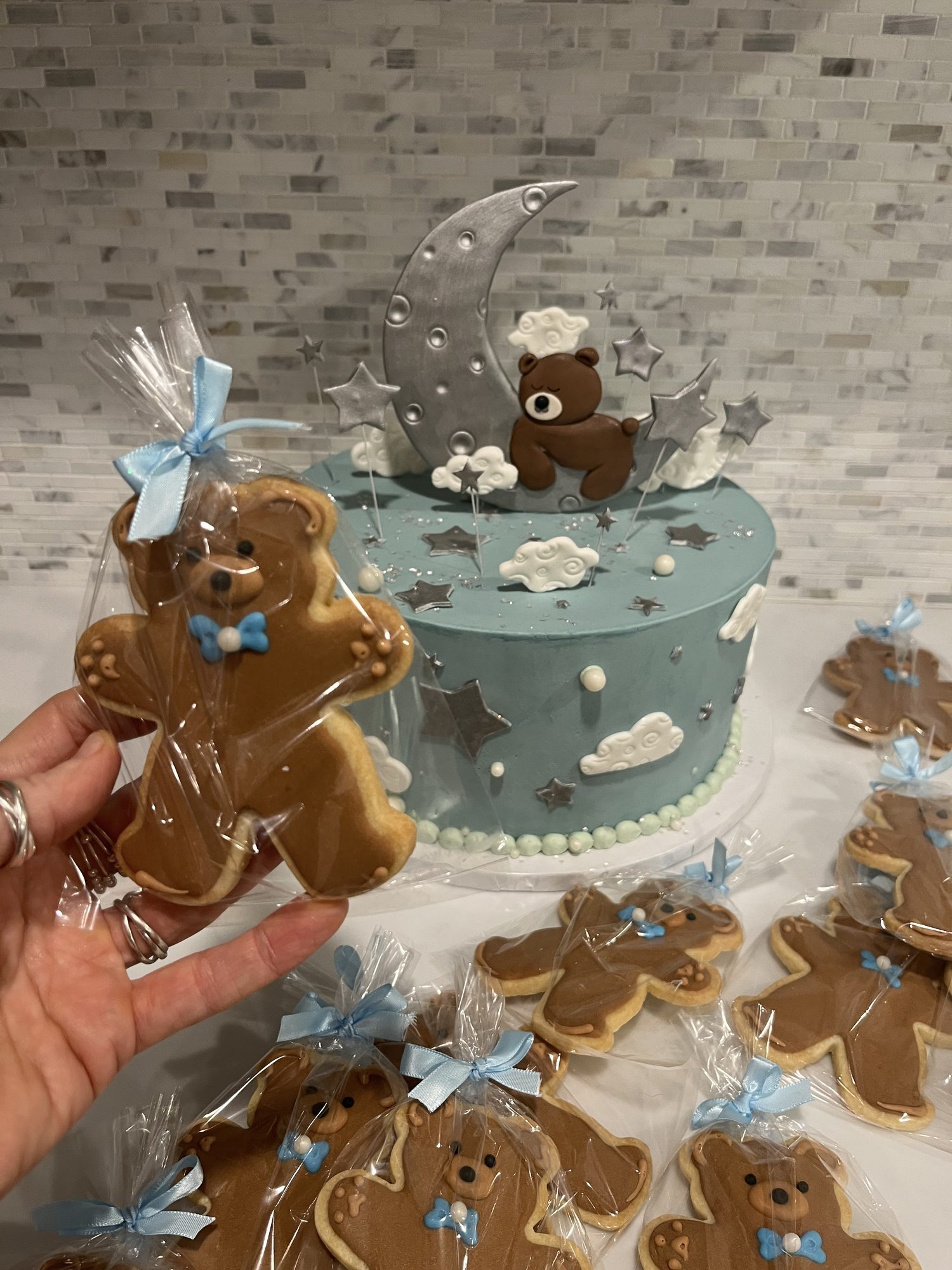 Teddy bear baby shower cake with matching cookies